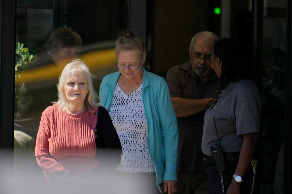 May Martinez, left, mother of murder victim Colleen Slemmer, walks out of Riverbend Maximum Security Institution during a stay of the planned execution of Christa Pike, Wednesday, Sept. 30, 2026, in Nashville, Tenn. (AP)