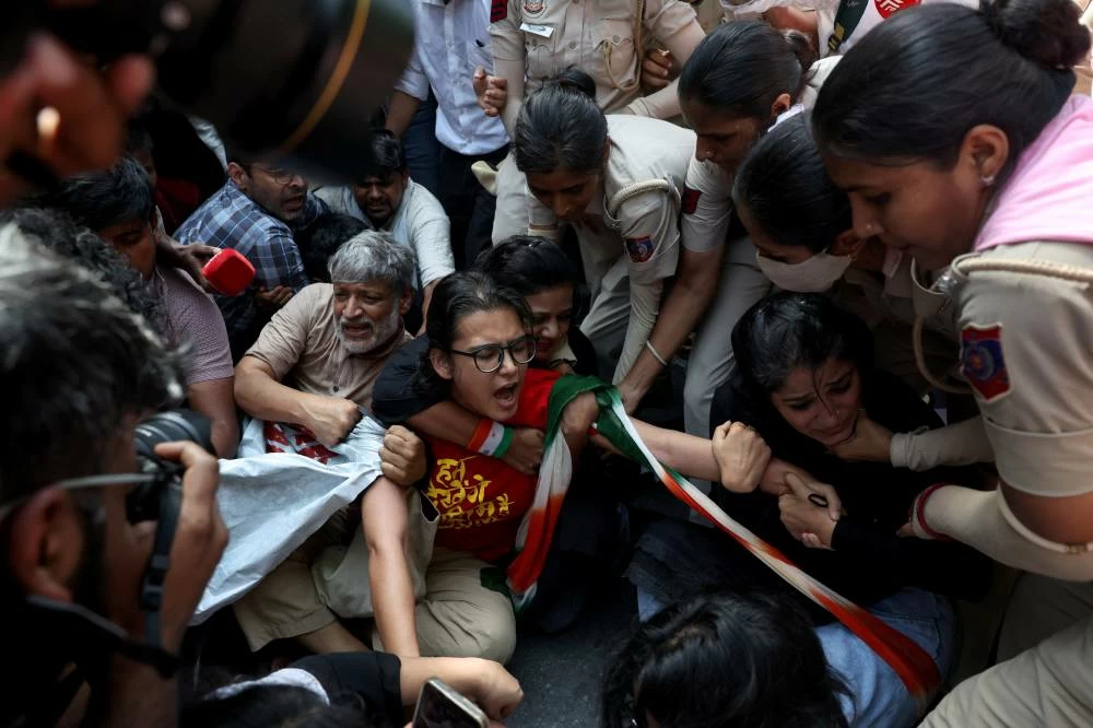 Neha Bora, National President of the All India Students' Association (AISA), reacts as she is detained by police during a protest demanding the resignation of India's Chief Election Commissioner Gyanesh Kumar, in New Delhi, India, October 2, 2026. REUTERS/Bhawika Chhabra