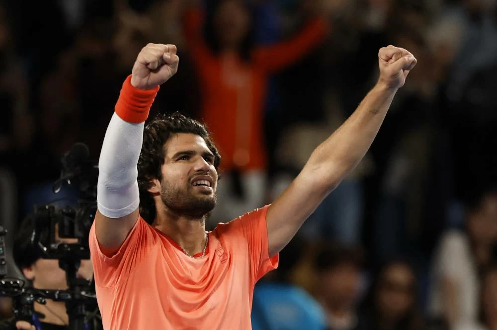Spain's Carlos Alcaraz celebrates after winning his semi final match against Spain's Jaume Munar. REUTERS