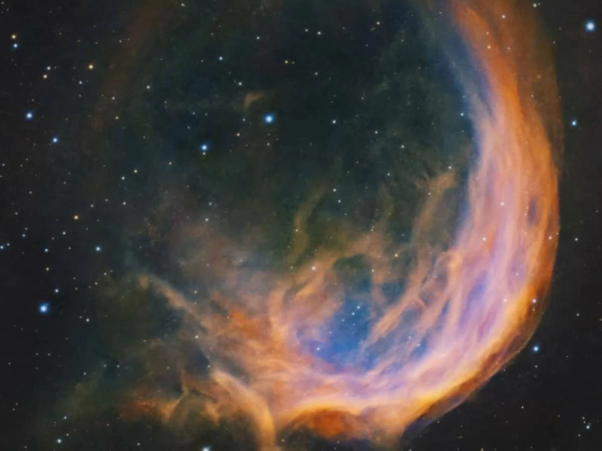 The nebula takes its name from its striking resemblance to the logo of the Firefox internet browser. Its brightest section appears as a spiralling arc of gas, while fainter surrounding gases complete the distinctive shape. WAM