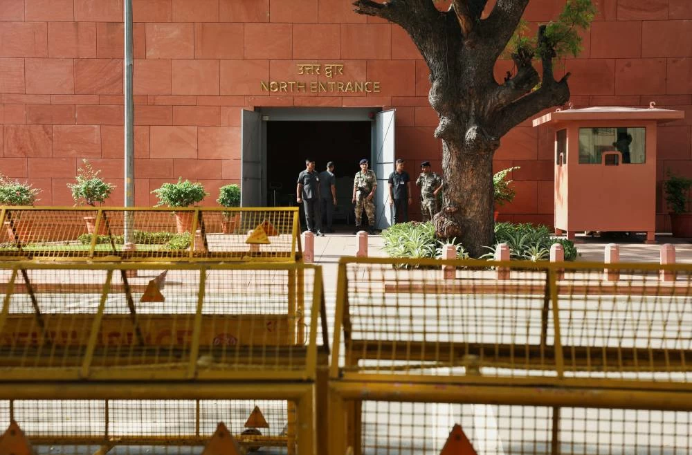 Security personnel stand behind barricades ahead of a protest organised by opposition parties demanding the resignation of Chief Election Commissioner Gyanesh Kumar at the north entrance of Parliament in New Delhi, India, October 6, 2026. REUTERS/Bhawika Chhabra