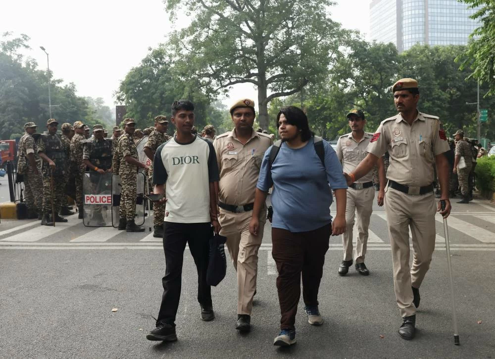 Security personnel detain supporters of the Cockroach Janta Party (CJP) during a protest seeking the resignation of India's Chief Election Commissioner, Gyanesh Kumar, in New Delhi, India, October 10, 2026. (Reuters)