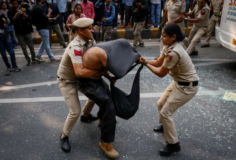 Security personnel detain a protestor during a protest by the Cockroach Janta Party (CJP) seeking the resignation of India's Chief Election Commissioner Gyanesh Kumar, in New Delhi, India, October 10, 2026. (Reuters)