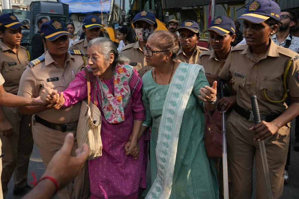 Protesters are detained by police during a protest demanding the resignation of the country's election chief, Gyanesh Kumar, in Mumbai, India, Saturday, Oct. 10, 2026.(AP)