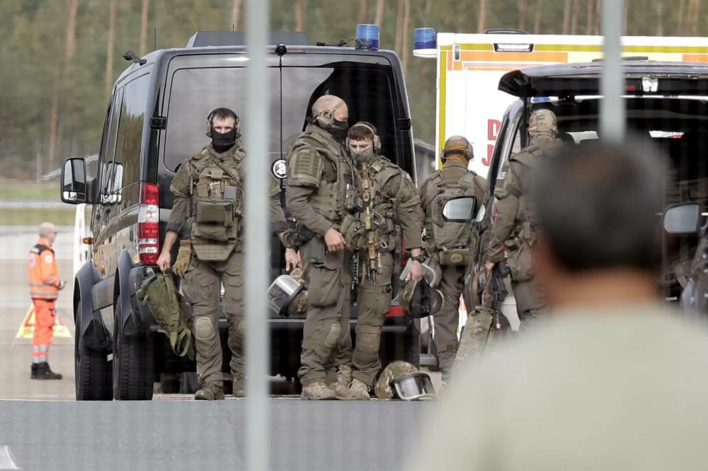 Members of a Police special operations unit (SEK) are on the move within the Nuremberg airport grounds in Nuremberg, Germany, Tuesday, Oct. 13, 2026. (AP)