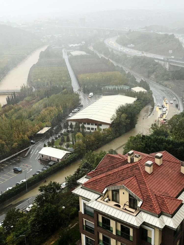 Vehicles are seen next to a partially flooded highway during heavy rains in Istanbul, Turkey, Wednesday, Oct. 14, 2026. (AP)