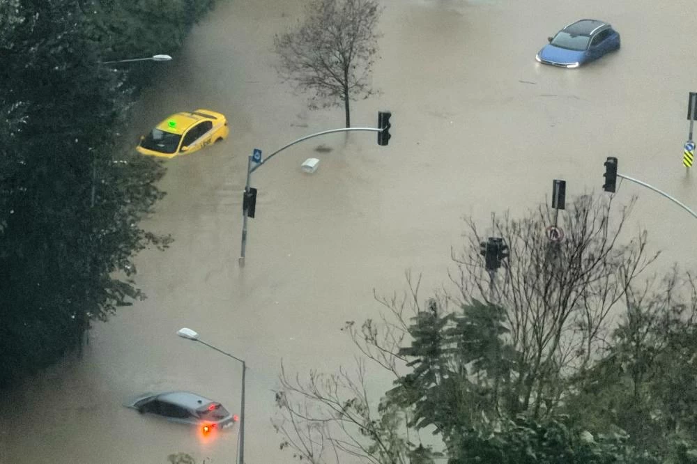 Vehicles are stranded in a partially flooded highway during heavy rains in Istanbul, Turkey, Wednesday, Oct. 14, 2026.  (AP)