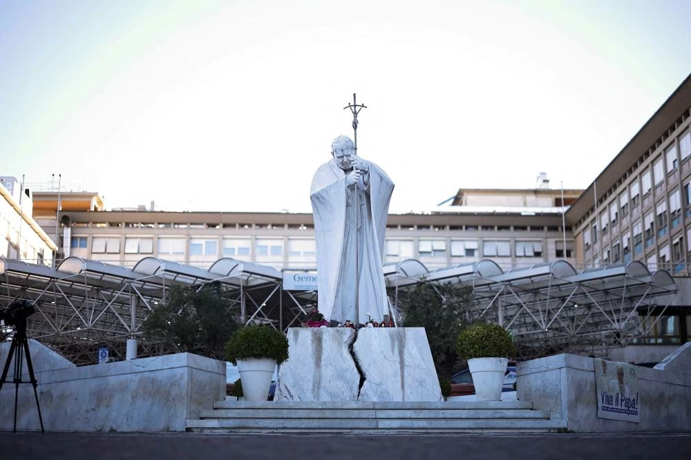 The statue of John Paul II outside Gemelli Hospital after the Vatican said Pope Leo had been diagnosed with lung cancer following surgery to remove part of his right lung, in Rome, Italy, October 15, 2026. (Reuters)