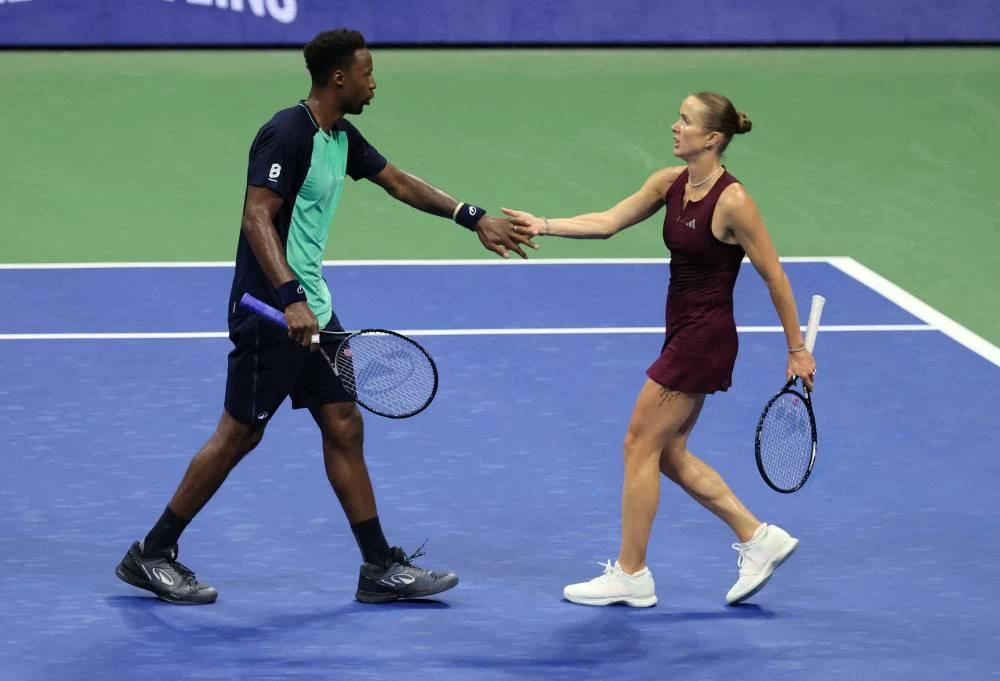 Gaël Monfils and Elina Svitolina in action during their US Open mixed doubles semi-final against Switzerland's Belinda Bencic and Italy's Flavio Cobolli at Flushing Meadows, New York, on August 26, 2026. (Reuters)