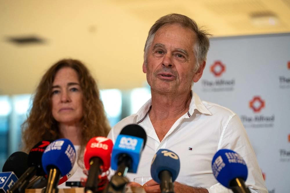 Phil Haines, husband of independent Australian lawmaker Helen Haines, announces that his wife has had both legs amputated after being rammed by a car outside her electoral office on Monday, during a press conference at Alfred Hospital in Melbourne, Australia, October 21, 2026. (Reuters)