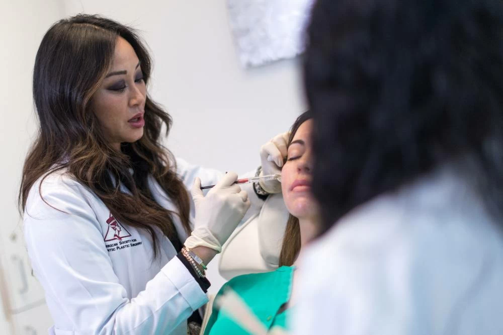 A patient receives a Sculptra injectable in Miami, Florida, US, December 2021. G(Reuters)