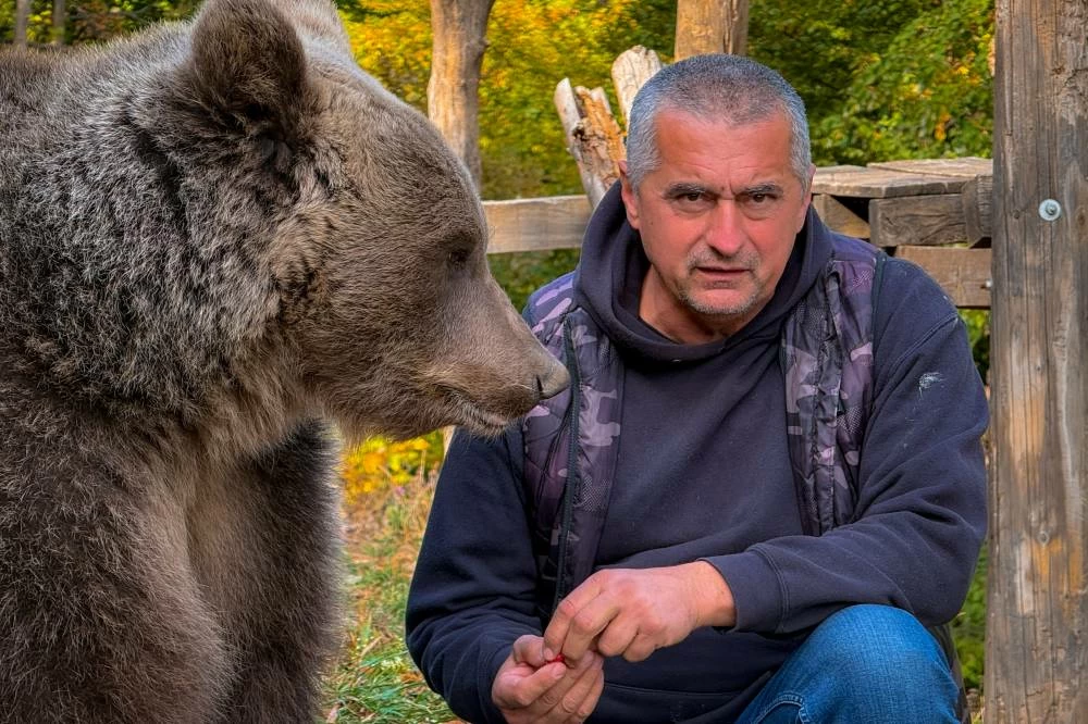 A Bosnian man rescued an abandoned bear cub. Now they're inseparable