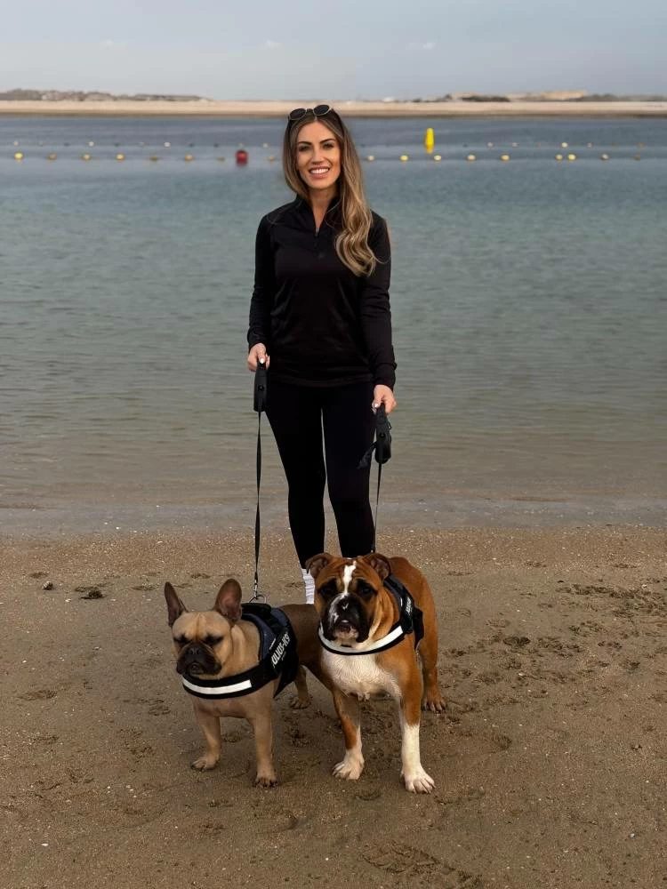 Thompson is pictured with her two dogs in Dubai. She also has two cats, and is a self-confessed animal lover. Picture credit: Supplied