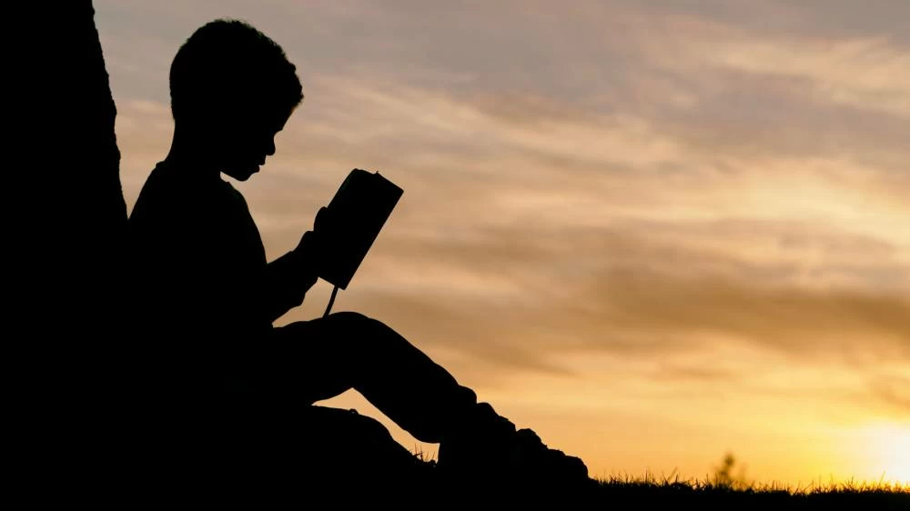 Reading is far more than a means of acquiring information. It is one of the most important ways in which we come to understand ourselves and the world around us. (Photo by Aaron Burden/Unsplash)