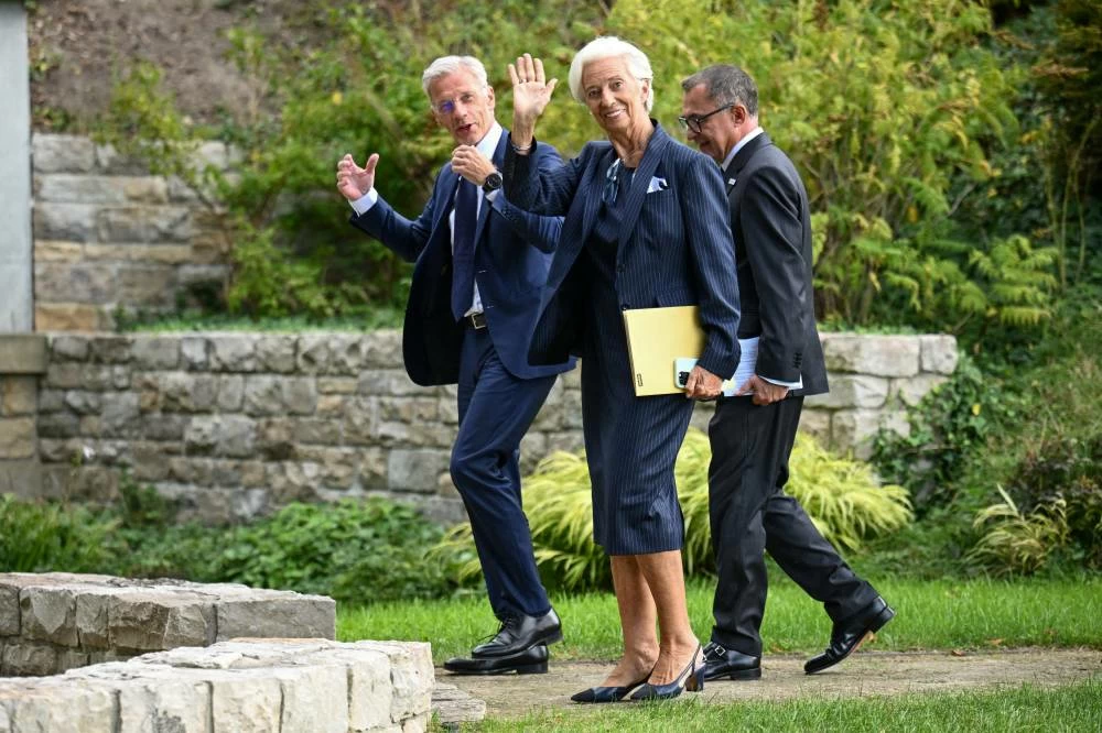 European Central Bank President Christine Lagarde waves as she walks with European Central Bank Vice President Boris Vujcic and President of Deutsche Bundesbank Joachim Nagel, on the day of a ECB Governing Council meeting at the guest house of the Deutsche Bundesbank in Berlin, Germany, September 10, 2026. (Reuters)